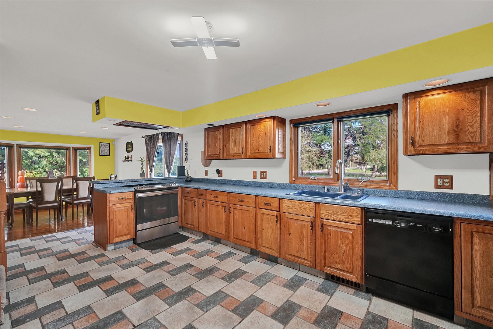 6514 South Oak Grove Road Harvard, IL 60033 - Photo 6 of 51 a large kitchen with stainless steel appliances granite countertop a sink and cabinets