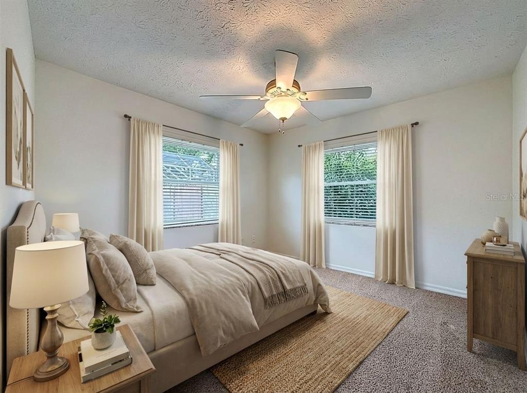 2414 Buckhorn Run Drive Valrico, FL 33596 - Photo 22 of 50 a bedroom with a bed and a chandelier