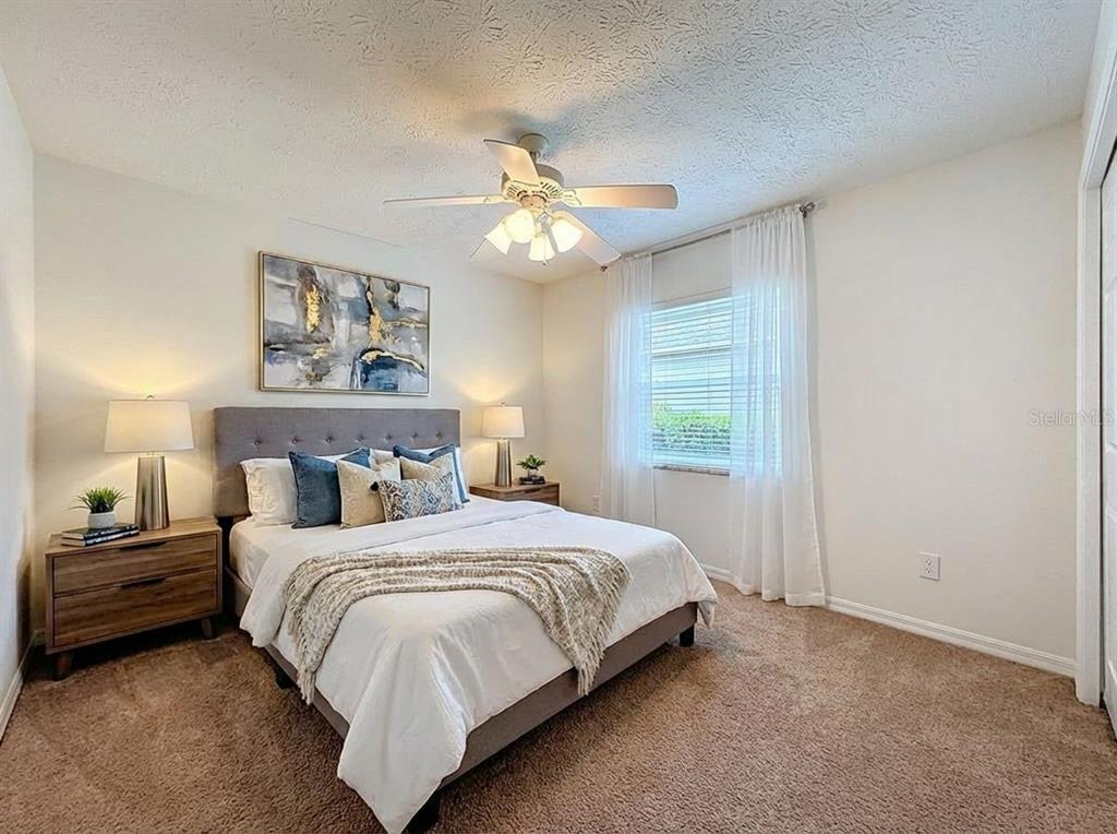 2414 Buckhorn Run Drive Valrico, FL 33596 - Photo 24 of 50 a bedroom with a bed and a window