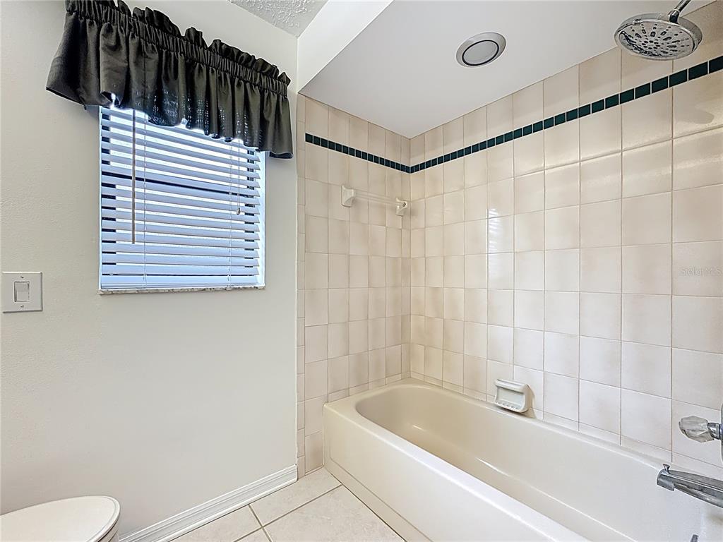 2414 Buckhorn Run Drive Valrico, FL 33596 - Photo 26 of 50 a bathroom with a bathtub and a shower