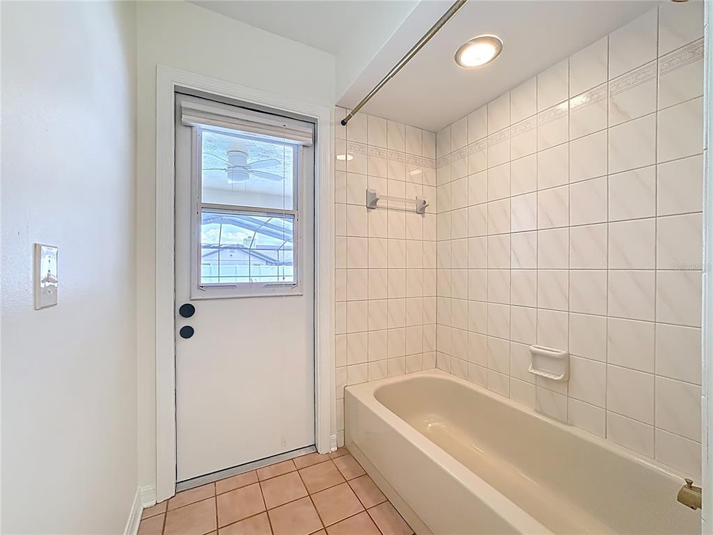 2414 Buckhorn Run Drive Valrico, FL 33596 - Photo 33 of 50 a bathroom with a bathtub a window a shower and vanity