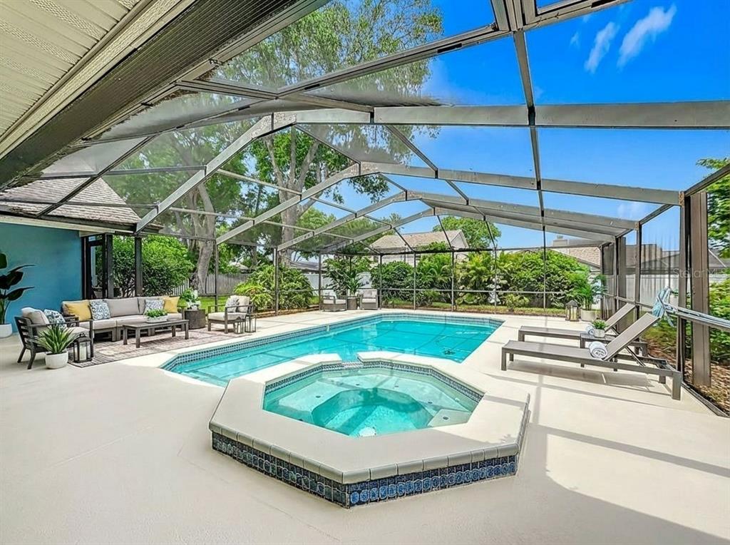 2414 Buckhorn Run Drive Valrico, FL 33596 - Photo 34 of 50 a view of a patio with a table and chairs