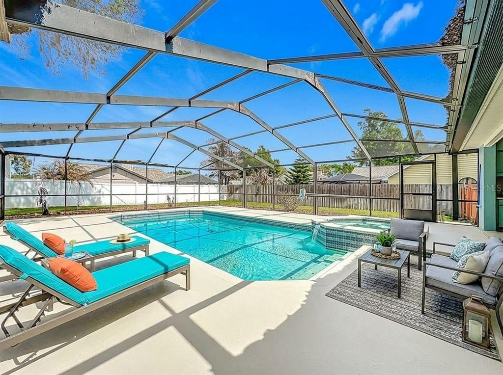 2414 Buckhorn Run Drive Valrico, FL 33596 - Photo 35 of 50 a patio with a table and chairs