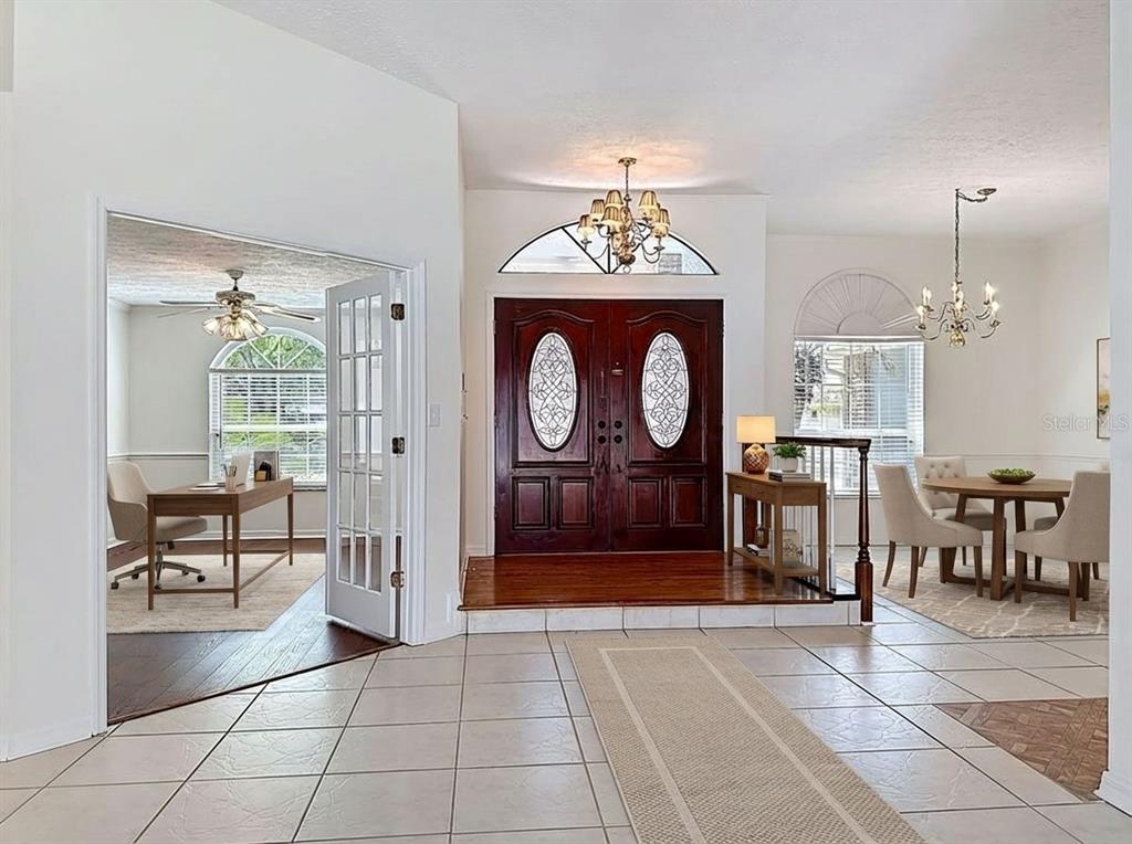 2414 Buckhorn Run Drive Valrico, FL 33596 - Photo 5 of 50 a view of a livingroom with furniture a dinning room and chandelier