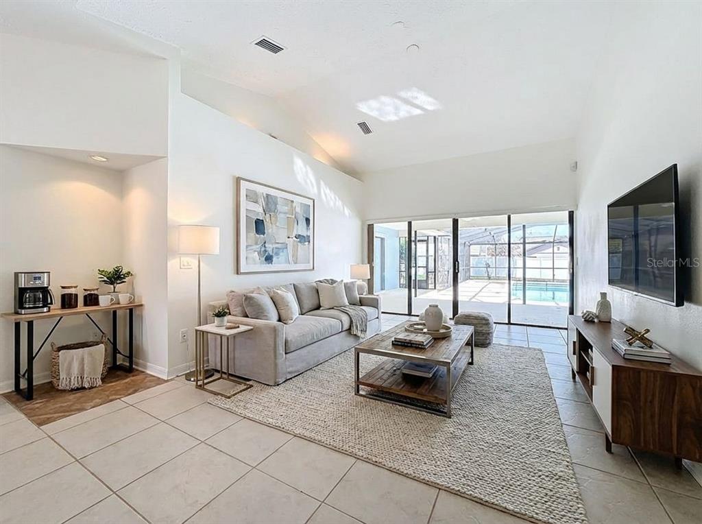 2414 Buckhorn Run Drive Valrico, FL 33596 - Photo 8 of 50 a living room with furniture and a flat screen tv