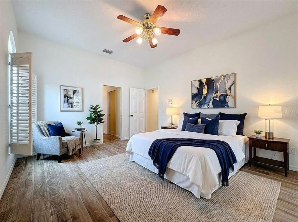 2414 Buckhorn Run Drive Valrico, FL 33596 - Photo 9 of 50 a spacious bedroom with a bed and a couch