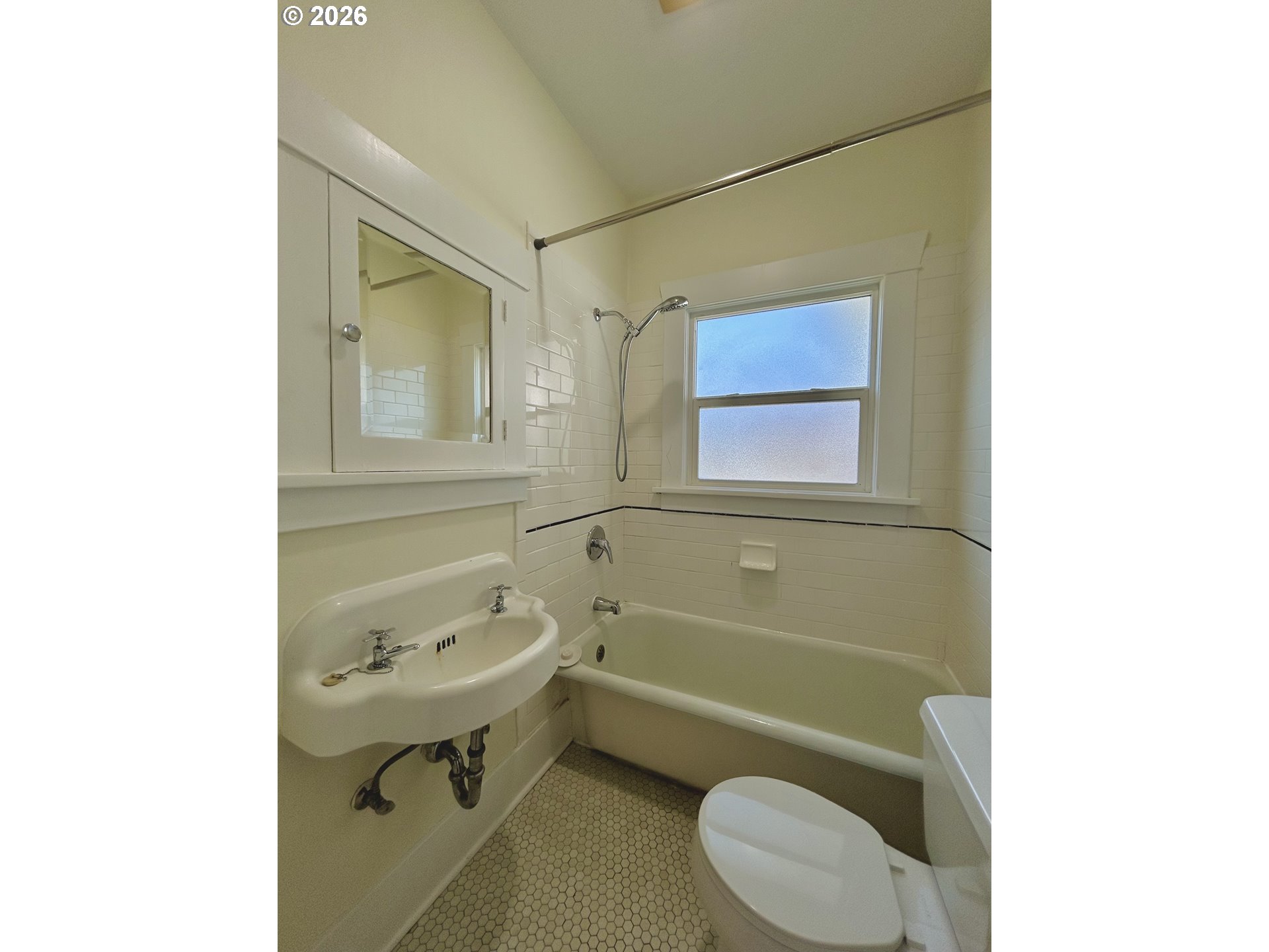 2202 Northeast Everett Street Portland, OR 97232 - Photo 21 of 25 a bathroom with a sink mirror vanity and toilet