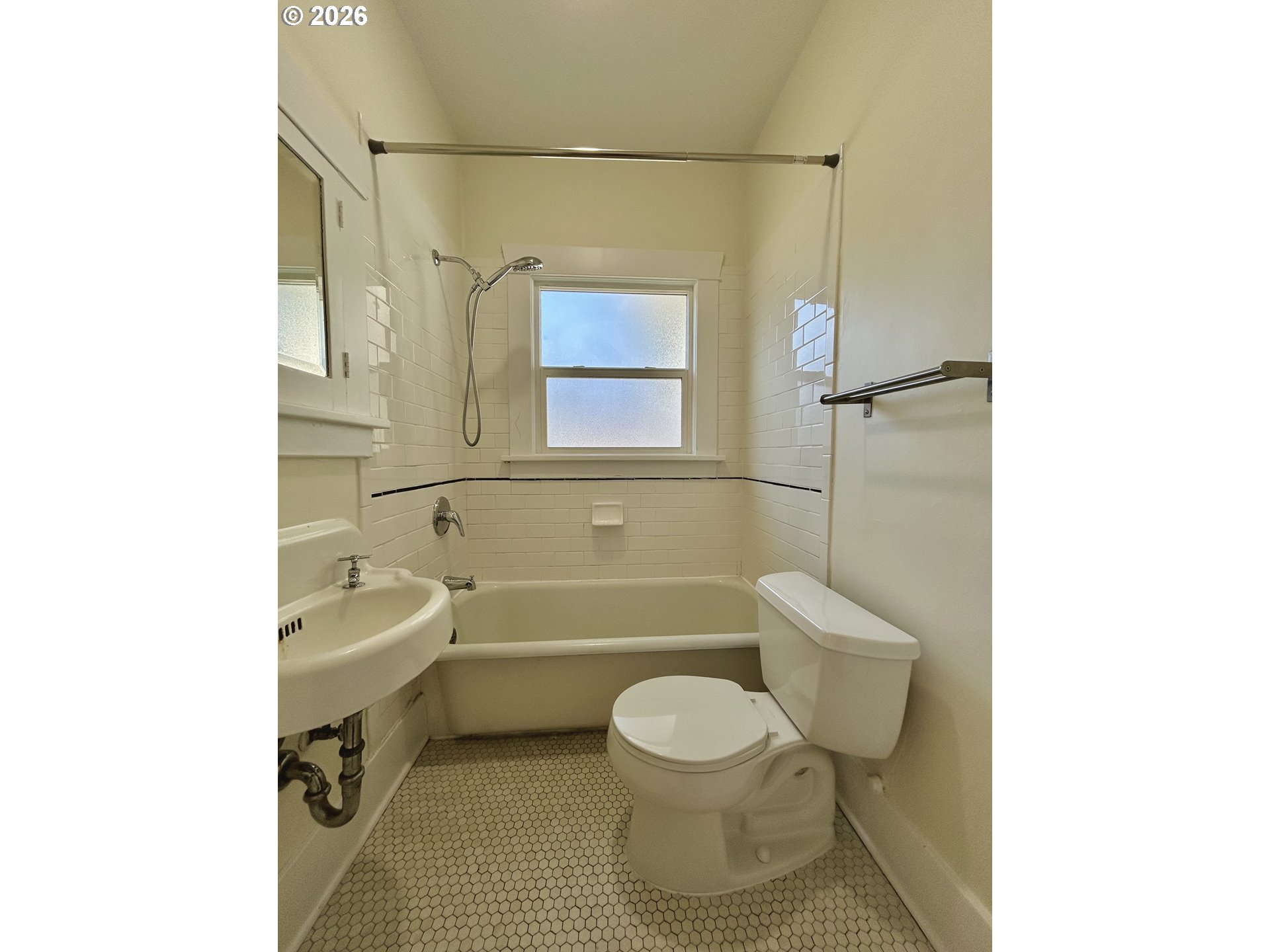 2202 Northeast Everett Street Portland, OR 97232 - Photo 22 of 25 a bathroom with a toilet a sink and bathtub