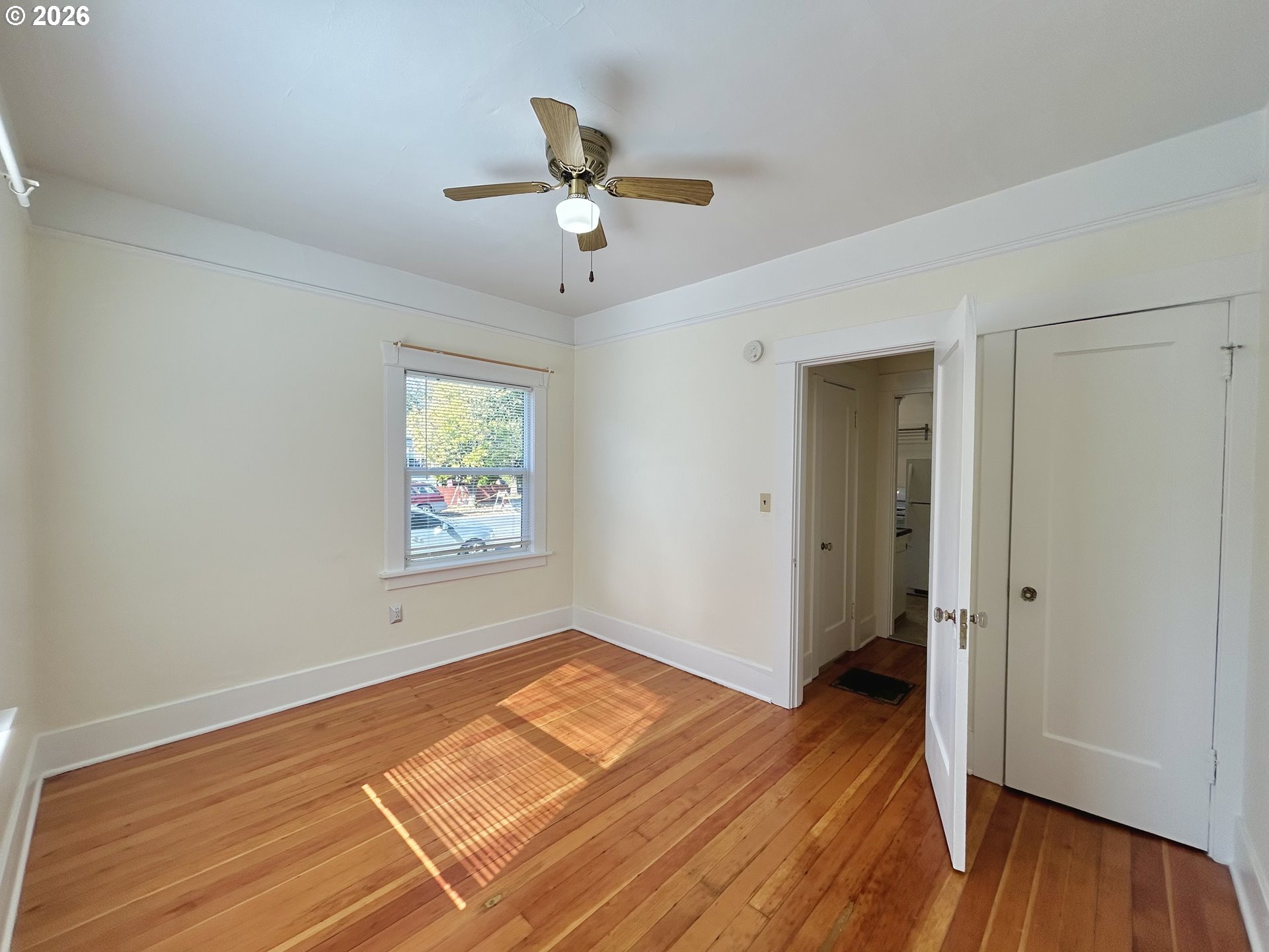 2202 Northeast Everett Street Portland, OR 97232 - Photo 25 of 25 a view of a room with wooden floor and ceiling fan