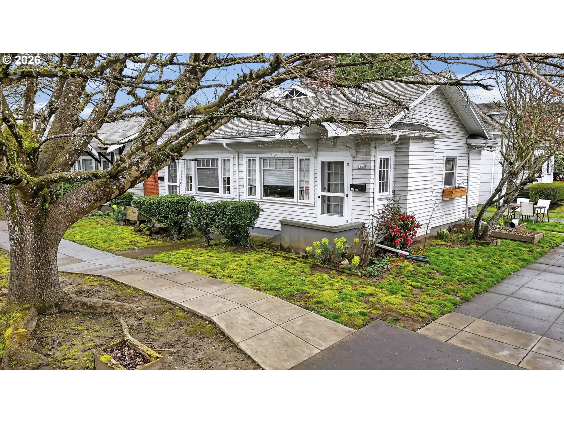 2202 Northeast Everett Street Portland, OR 97232 - Photo 4 of 25 a black and white house with a yard