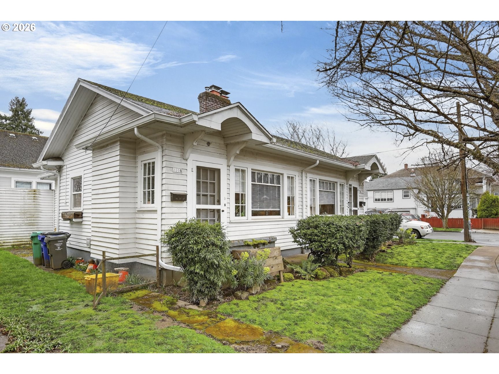 2202 Northeast Everett Street Portland, OR 97232 - Photo 5 of 25 a front view of a house with a yard