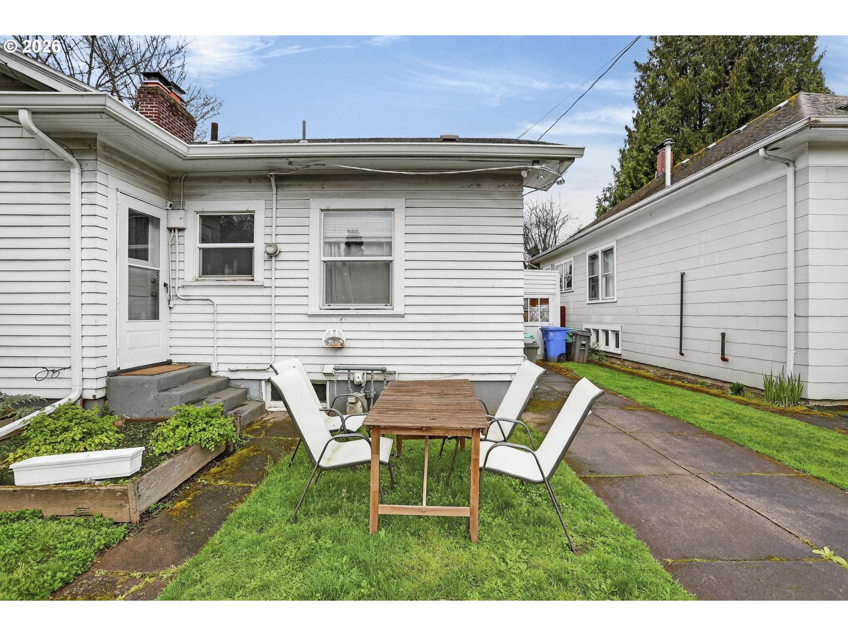 2202 Northeast Everett Street Portland, OR 97232 - Photo 7 of 25 a backyard of a house with table and chairs