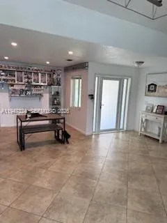 a view of kitchen with furniture and window