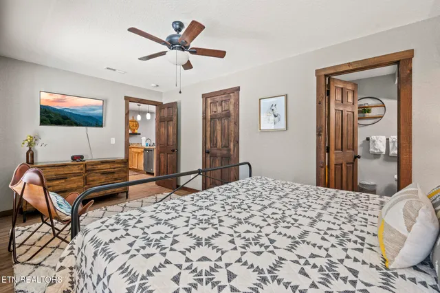 a wooden floor in a room next to a window