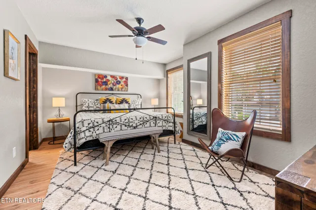 a bedroom with a bed and window