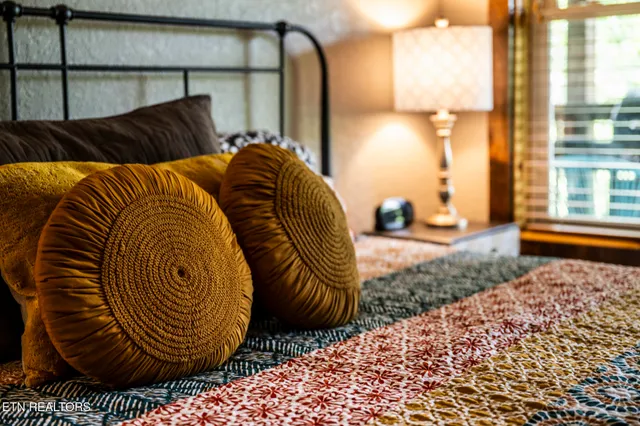 a bedroom with furniture and a window