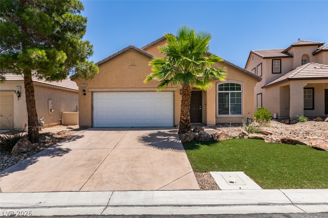 5150 Riverside Run Court North Las Vegas, NV 89081 - Photo 1 of 50 A desert oasis welcomes you home with a palm tree, mature landscaping, and an attached garage.