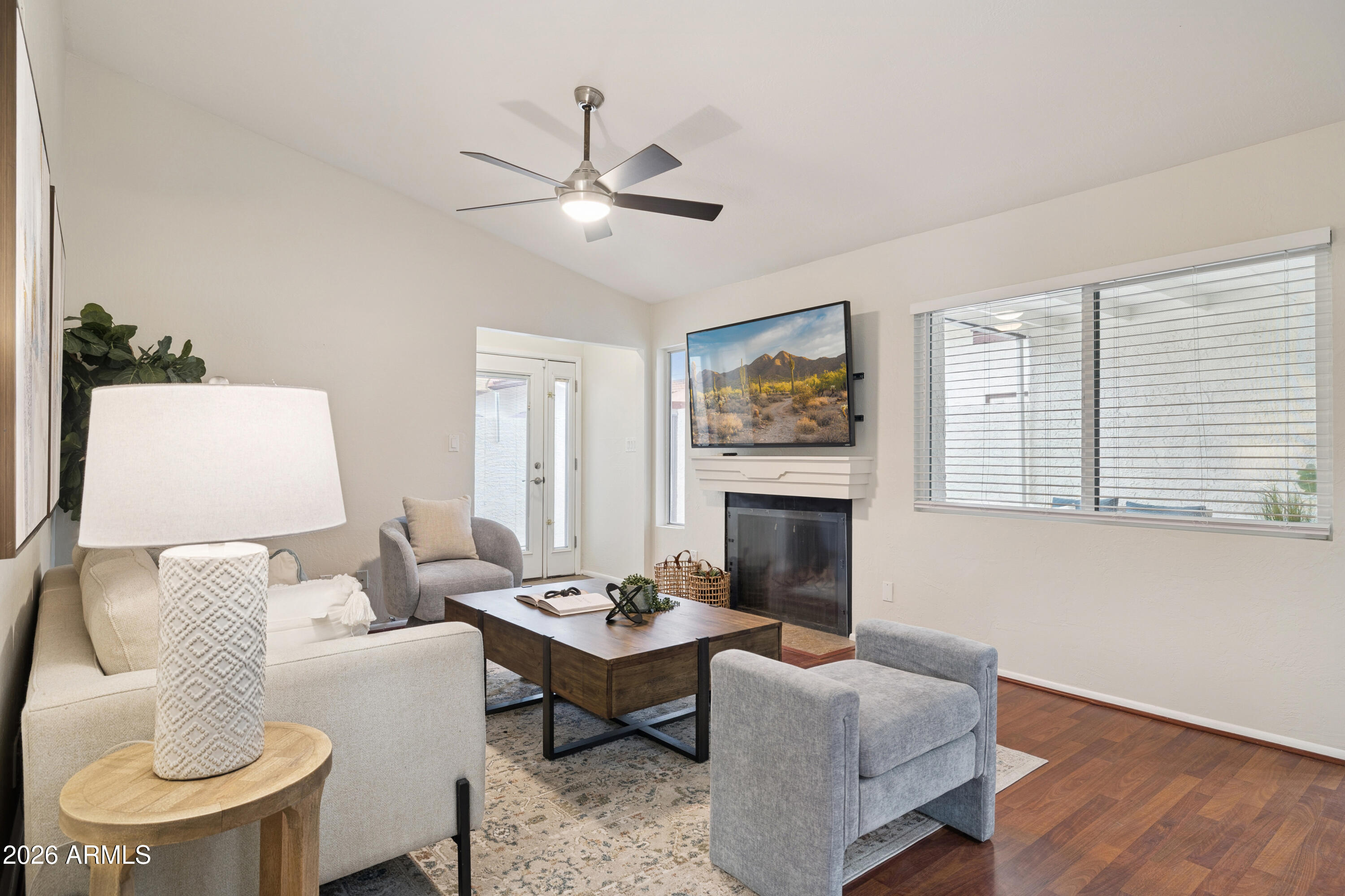 4343 East Osborn Road Phoenix, AZ 85018 - Photo 2 of 41 a living room with furniture and a fireplace