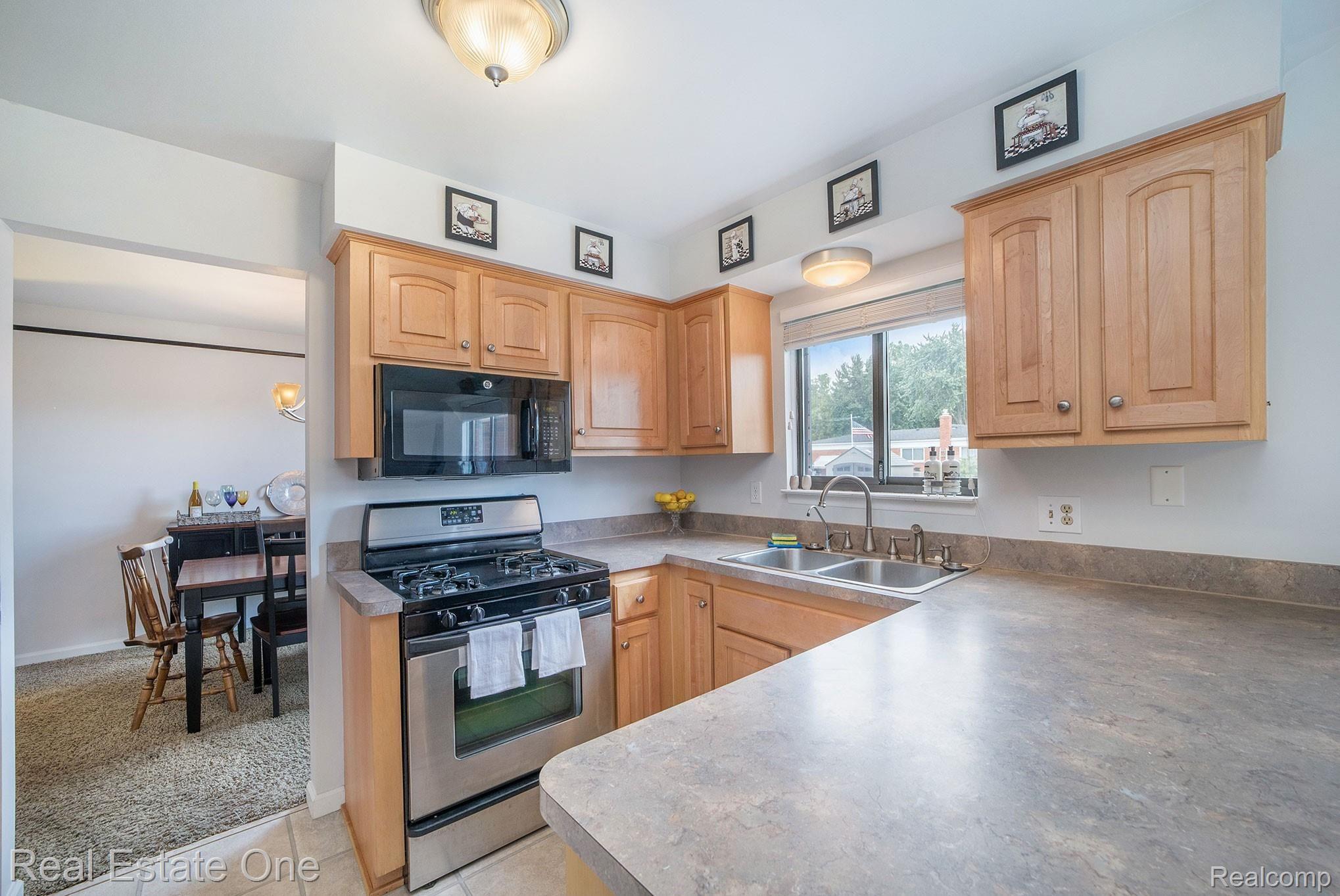 35750 Shell Drive Sterling Heights, MI 48310 - Photo 7 of 38 Kitchen with gas stove and good cabinet space.
