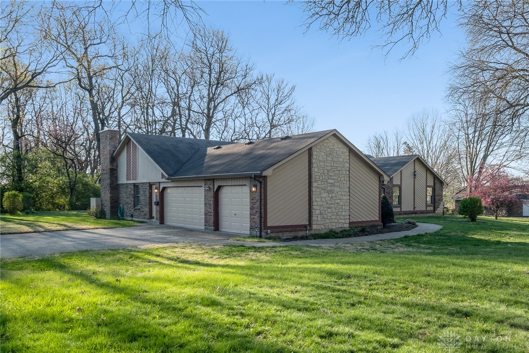 276 South Fairfield Road Bellbrook, OH 45305 - Photo 38 of 38 This residence showcases a timeless facade, lush green lawn, and ample parking.