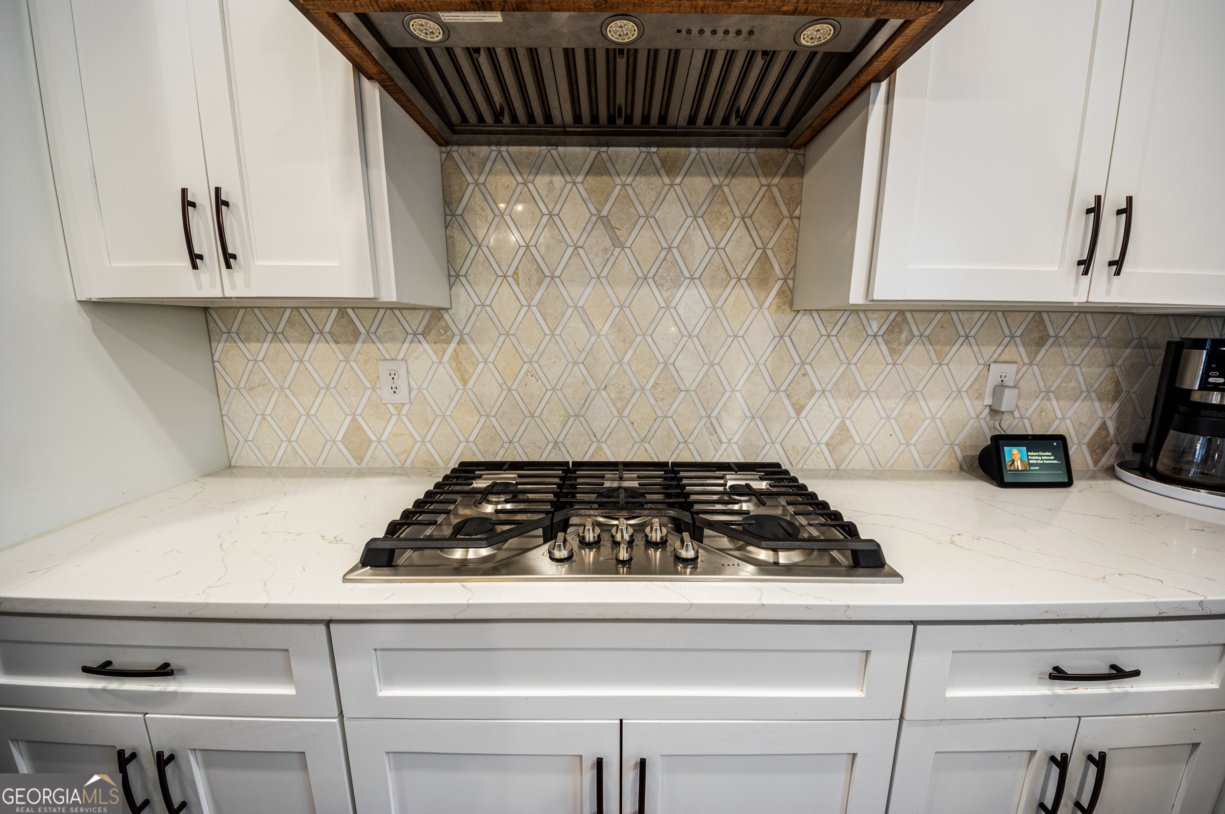 2736 Jones Holly Road Good Hope, GA 30641 - Photo 14 of 49 a kitchen with white cabinets and a stove top oven