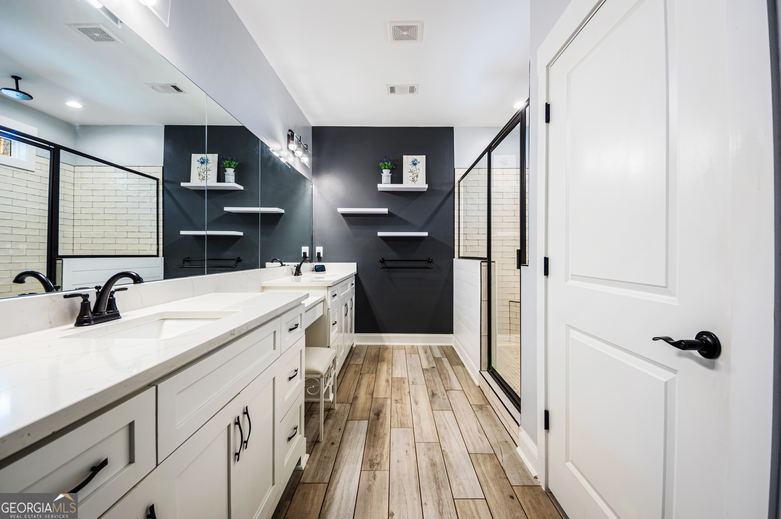 2736 Jones Holly Road Good Hope, GA 30641 - Photo 25 of 49 a en suite bathroom with a sink and a mirror