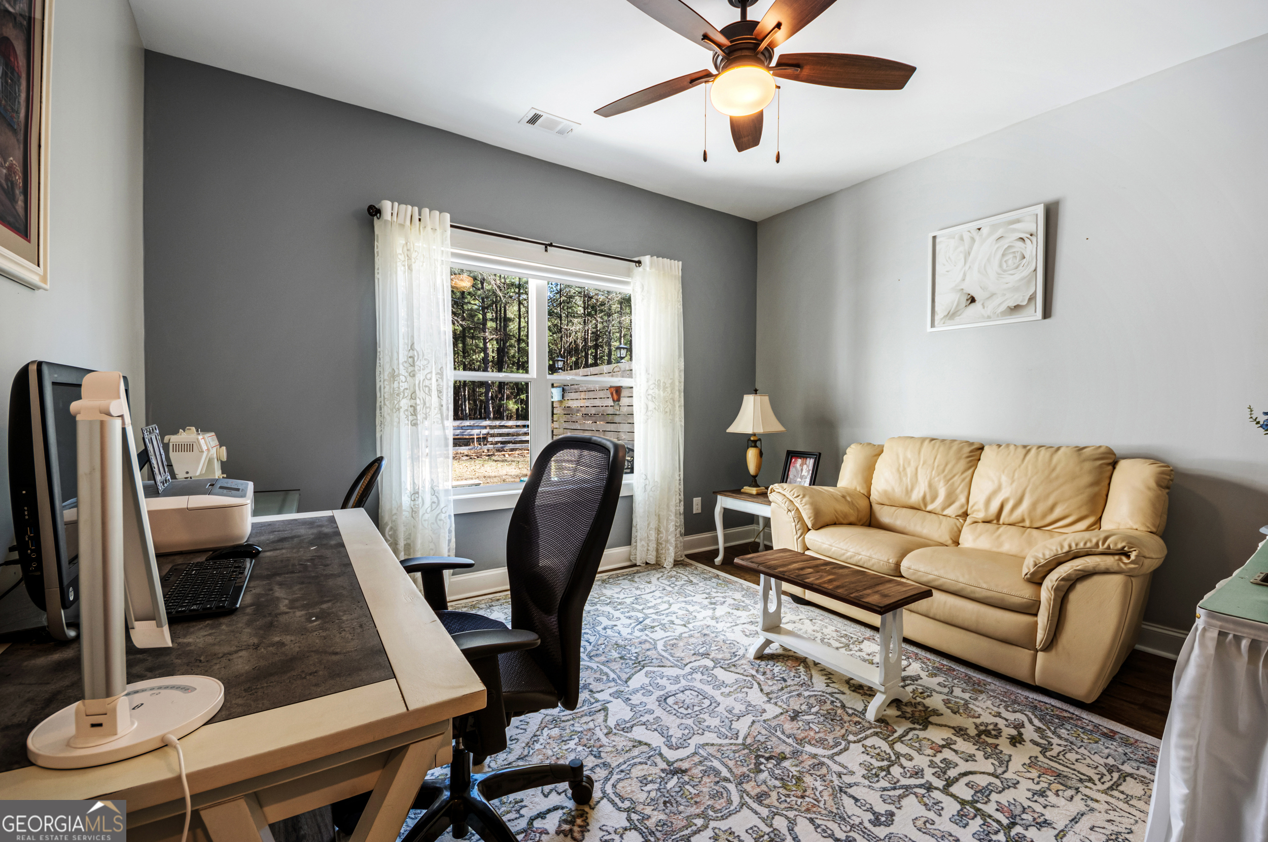 2736 Jones Holly Road Good Hope, GA 30641 - Photo 32 of 49 a living room with furniture and a window
