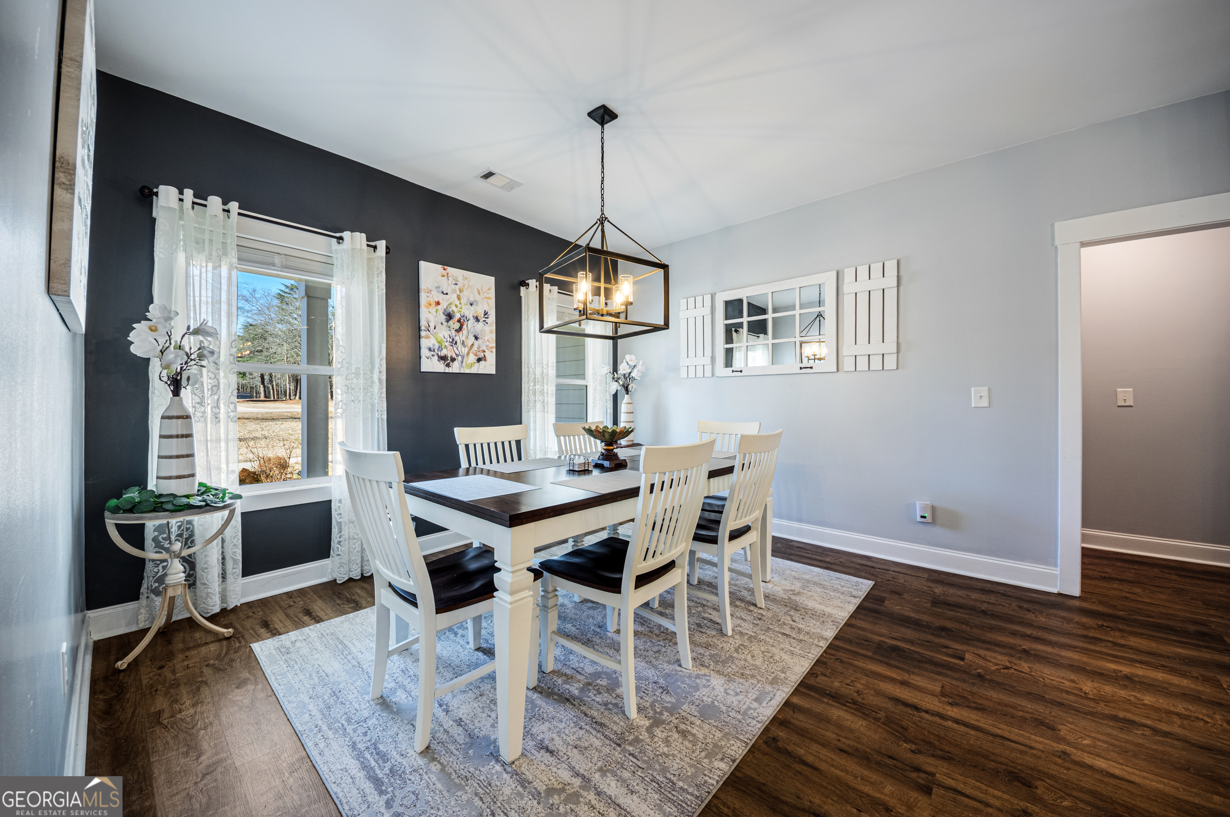 2736 Jones Holly Road Good Hope, GA 30641 - Photo 10 of 49 a view of a dining room with furniture window and wooden floor
