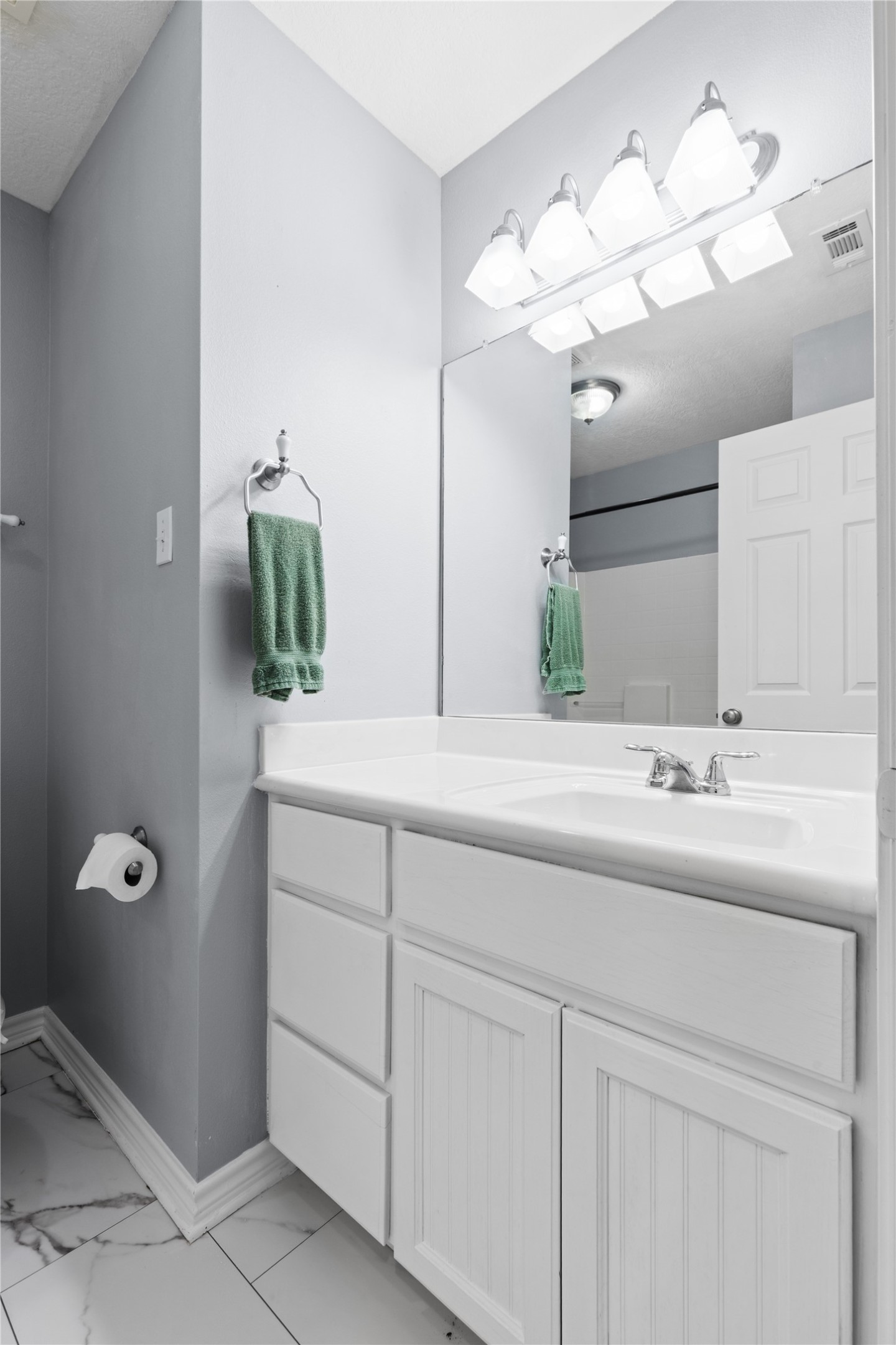 140 Meadowview Drive Trinity, TX 75862 - Photo 16 of 27 a bathroom with a sink a light fixture and a mirror