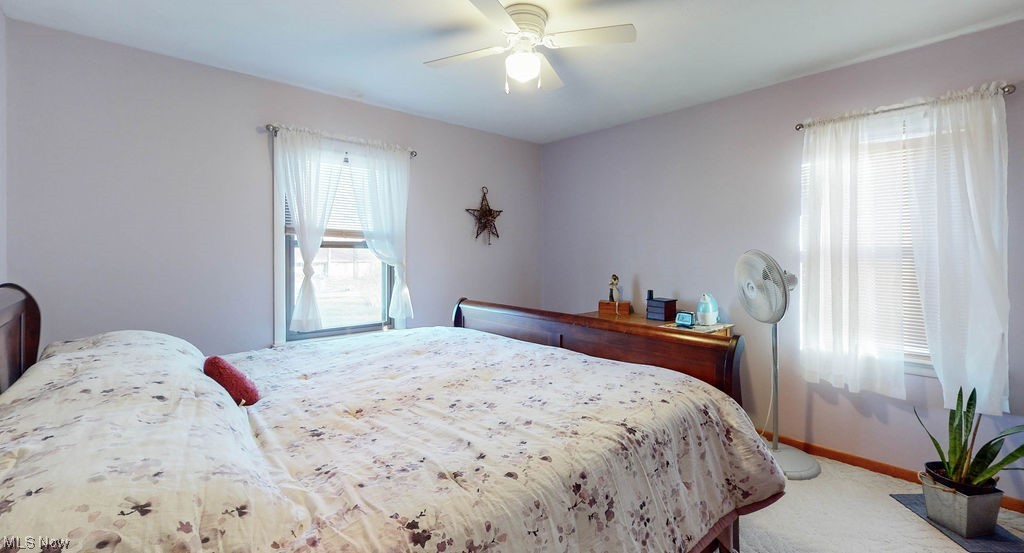 3180 Boston Road Brunswick, OH 44212 - Photo 16 of 41 Bedroom with ceiling fan and light colored carpet