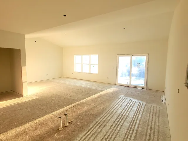 an empty room with windows