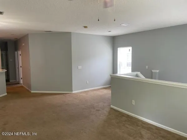 a view of a room with a chandelier