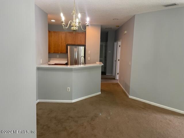 12301 Kernan Forest Boulevard, Unit 302 Jacksonville, FL 32225 - Photo 13 of 14 a view of a room with a chandelier