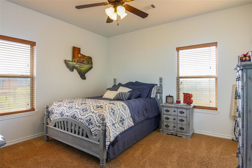 7158 Luella Road Sherman, TX 75090 - Photo 10 of 40 a bedroom with a bed dresser and window