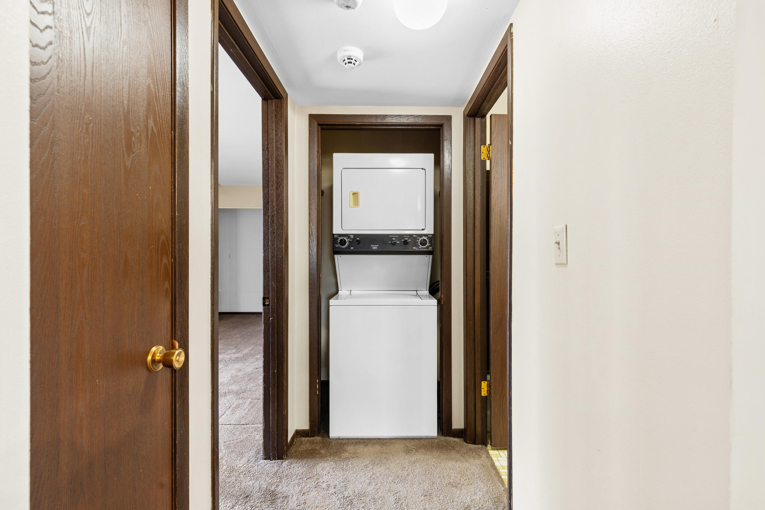 6980 North Raintree Court, Unit D Milwaukee, WI 53223 - Photo 6 of 16 Hallway with in unit laundry- appliances included
