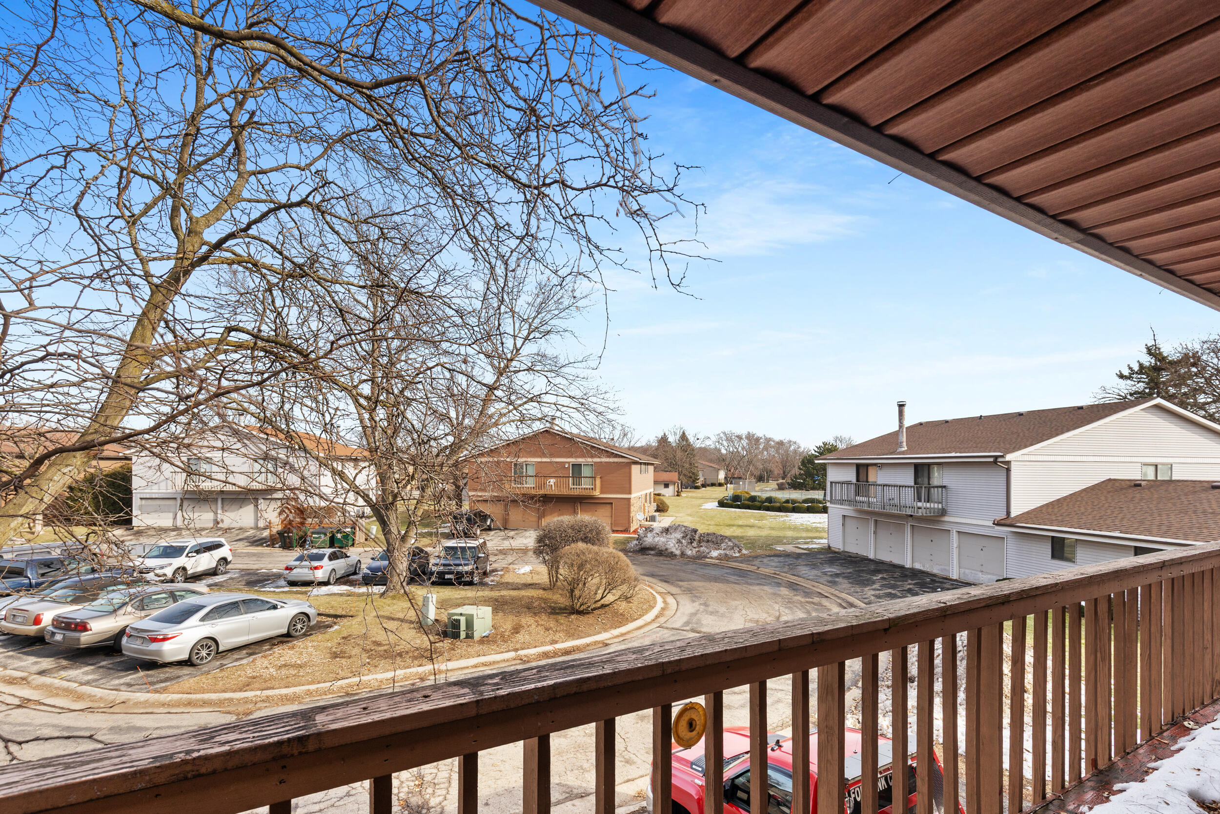 6980 North Raintree Court, Unit D Milwaukee, WI 53223 - Photo 10 of 16 Double door patio with view