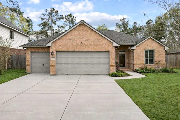 a view of a yard in front view of a house