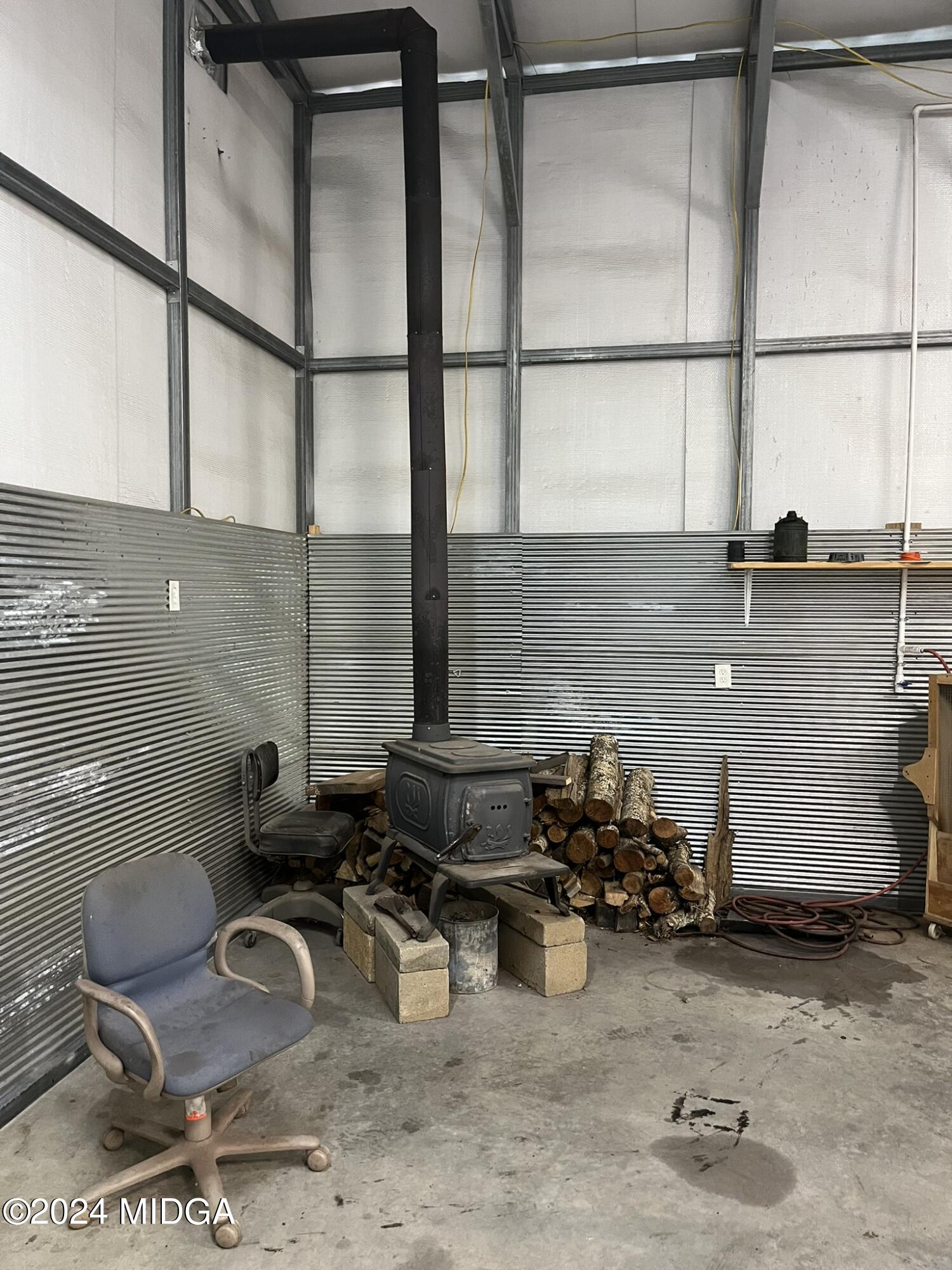 381 Elam Street Gordon, GA 31031 - Photo 17 of 28 wood burning stove- garage