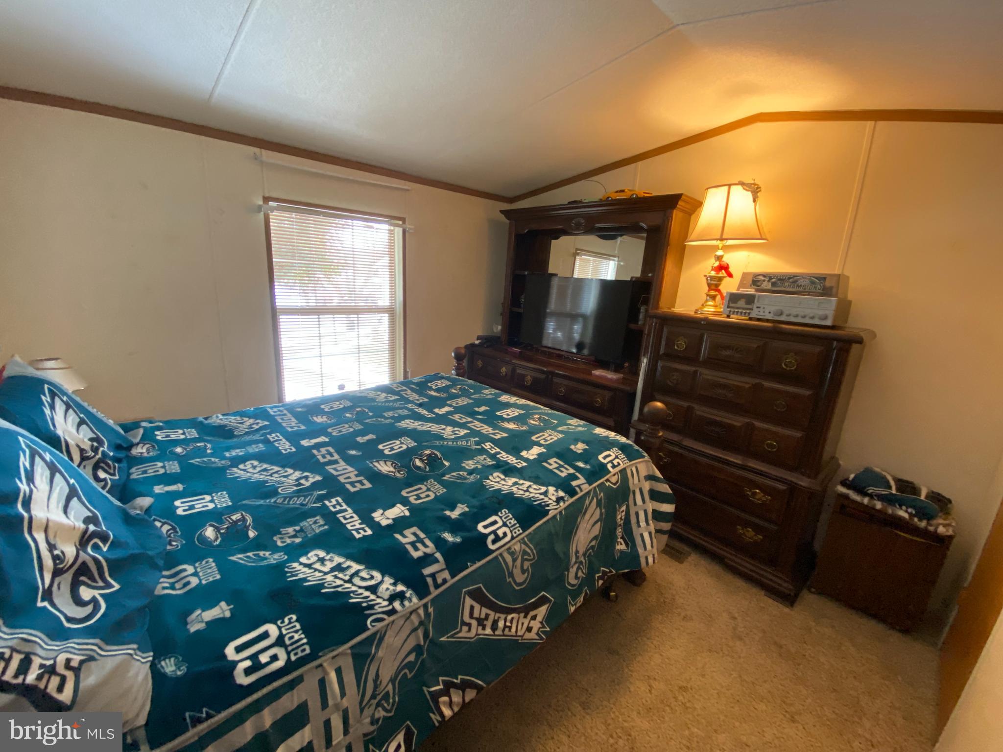 57 Ridgedale Avenue New Providence, PA 17560 - Photo 4 of 9 a bedroom with a bed next to a window