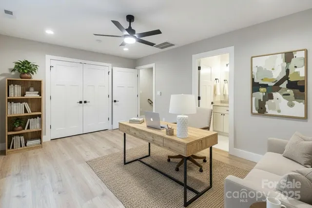 a workspace with furniture and wooden floor