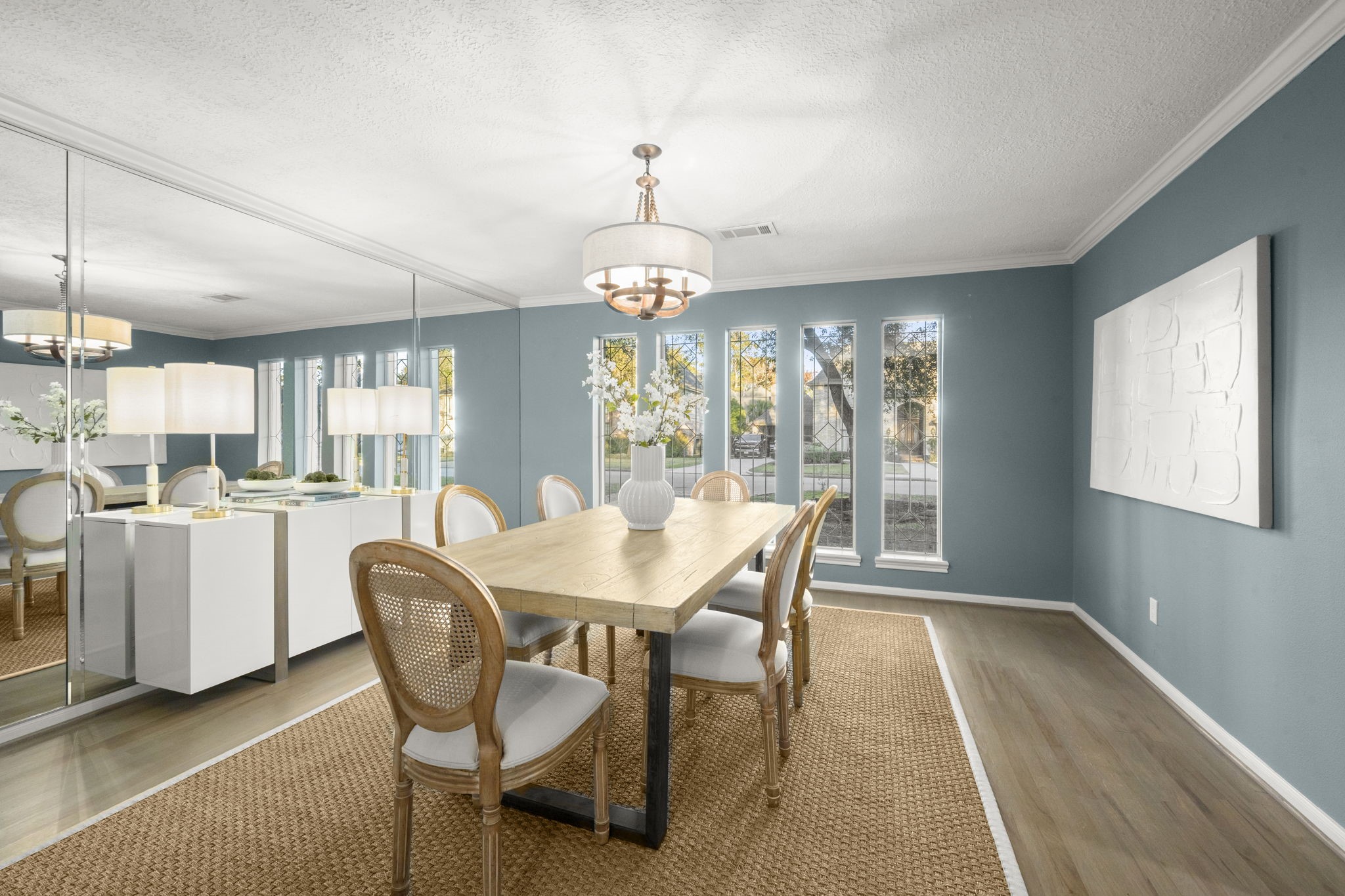 16111 Maplehurst Drive Spring, TX 77379 - Photo 7 of 30 a dining room with furniture a chandelier and wooden floor