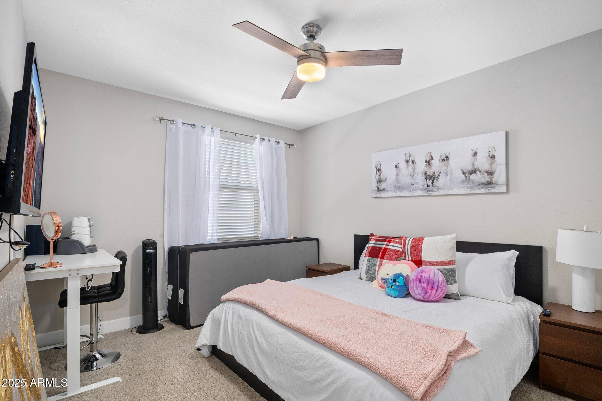 3855 South McQueen Road, Unit 21 Chandler, AZ 85286 - Photo 16 of 35 a bedroom with a bed and a window