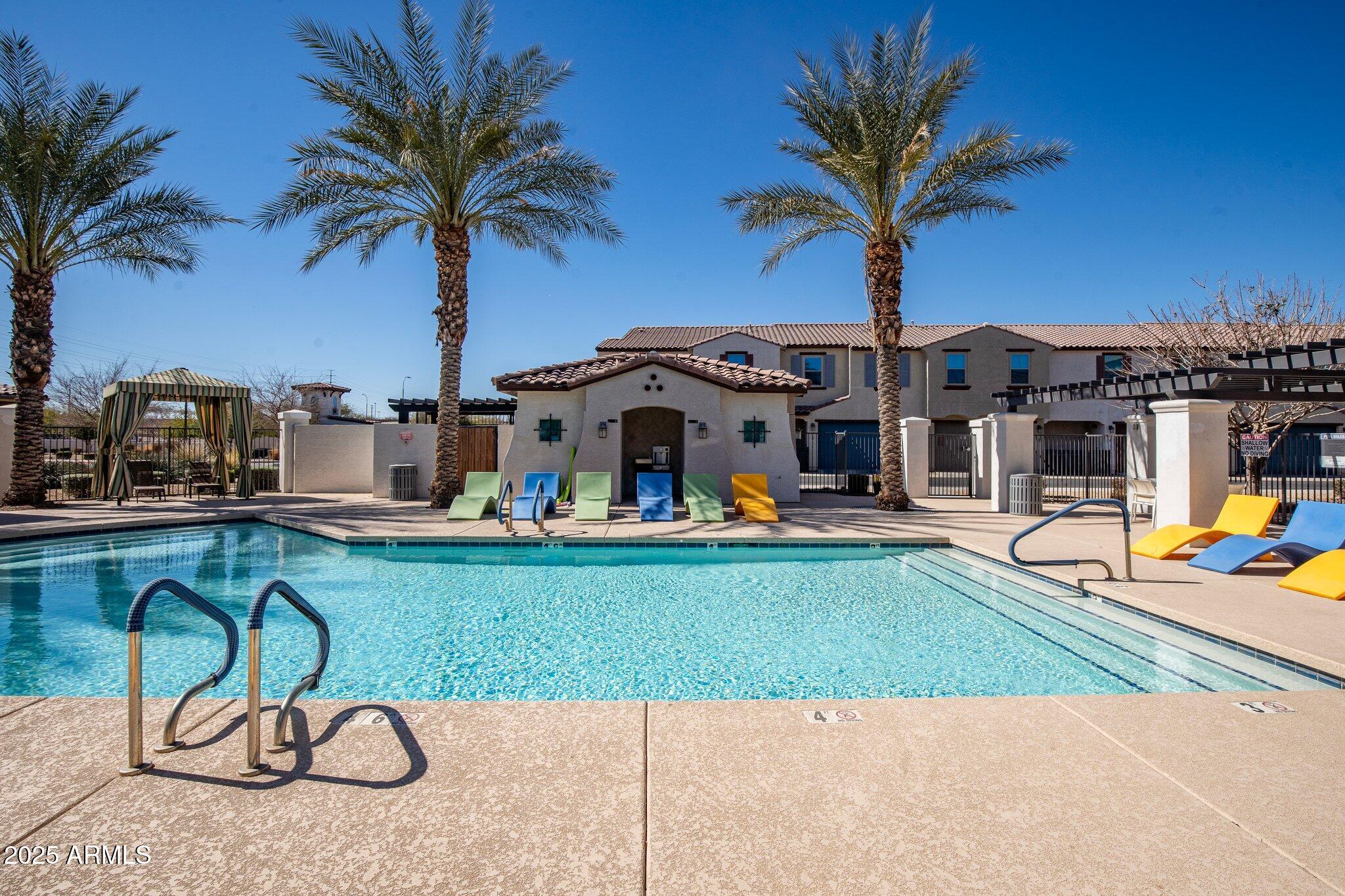 3855 South McQueen Road, Unit 21 Chandler, AZ 85286 - Photo 33 of 35 a swimming pool with outdoor seating yard and barbeque oven
