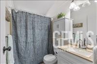 Undisclosed Address Tehachapi, CA 93561 - Photo 12 of 28 a bathroom with a granite countertop sink vanity mirror and toilet