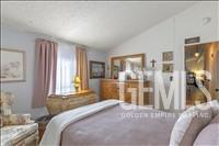 Undisclosed Address Tehachapi, CA 93561 - Photo 14 of 28 a bedroom with a bed and a window