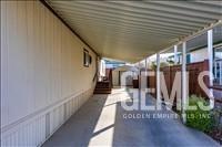 Undisclosed Address Tehachapi, CA 93561 - Photo 24 of 28 a view of a hallway with wooden floor and staircase