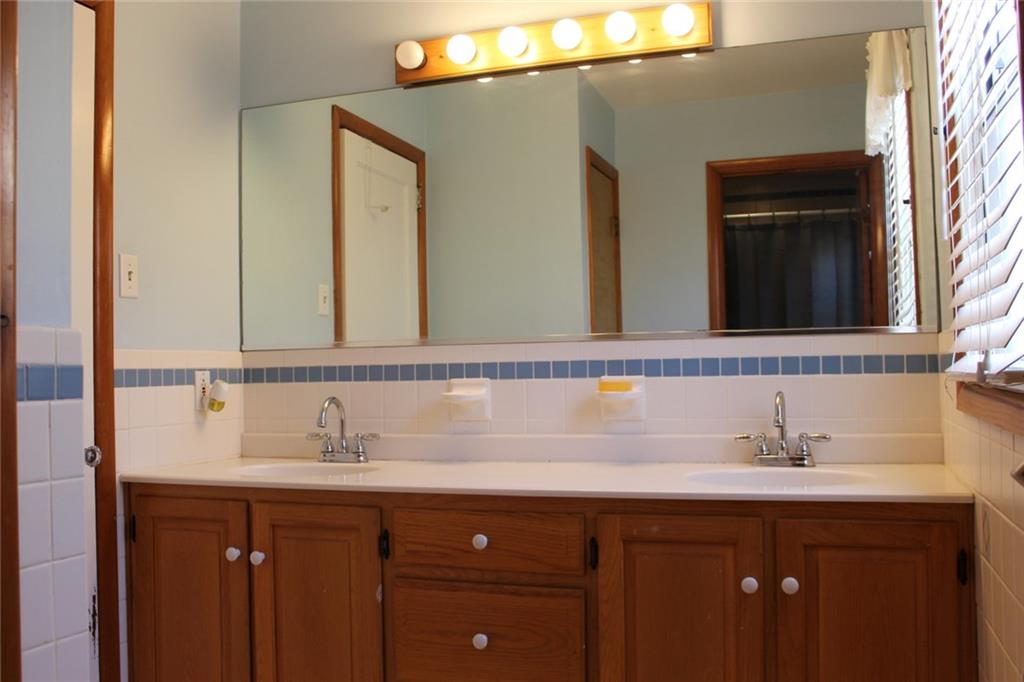 184 Richbarn Road Pittsburgh, PA 15212 - Photo 12 of 16 This full bathroom with a large double bowl vanity has a private jet tub and toilet.