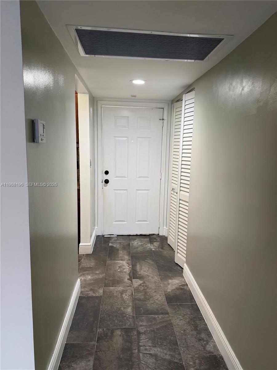 9355 Southwest 8th Street, Unit 305 Boca Raton, FL 33428 - Photo 7 of 12 a view of a hallway