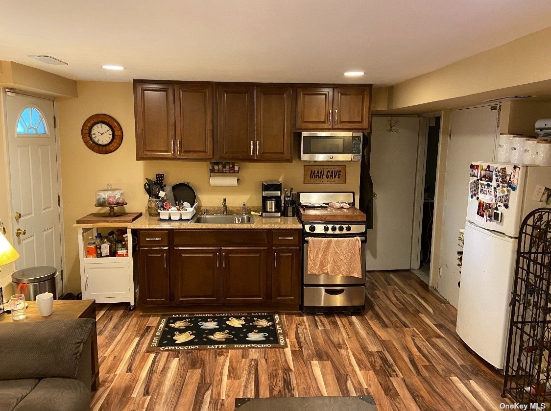 7 St Clair Street Deer Park, NY 11729 - Photo 1 of 1 a kitchen with sink a stove and refrigerator