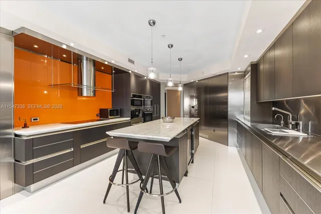 a view of a livingroom with furniture and a potted plant